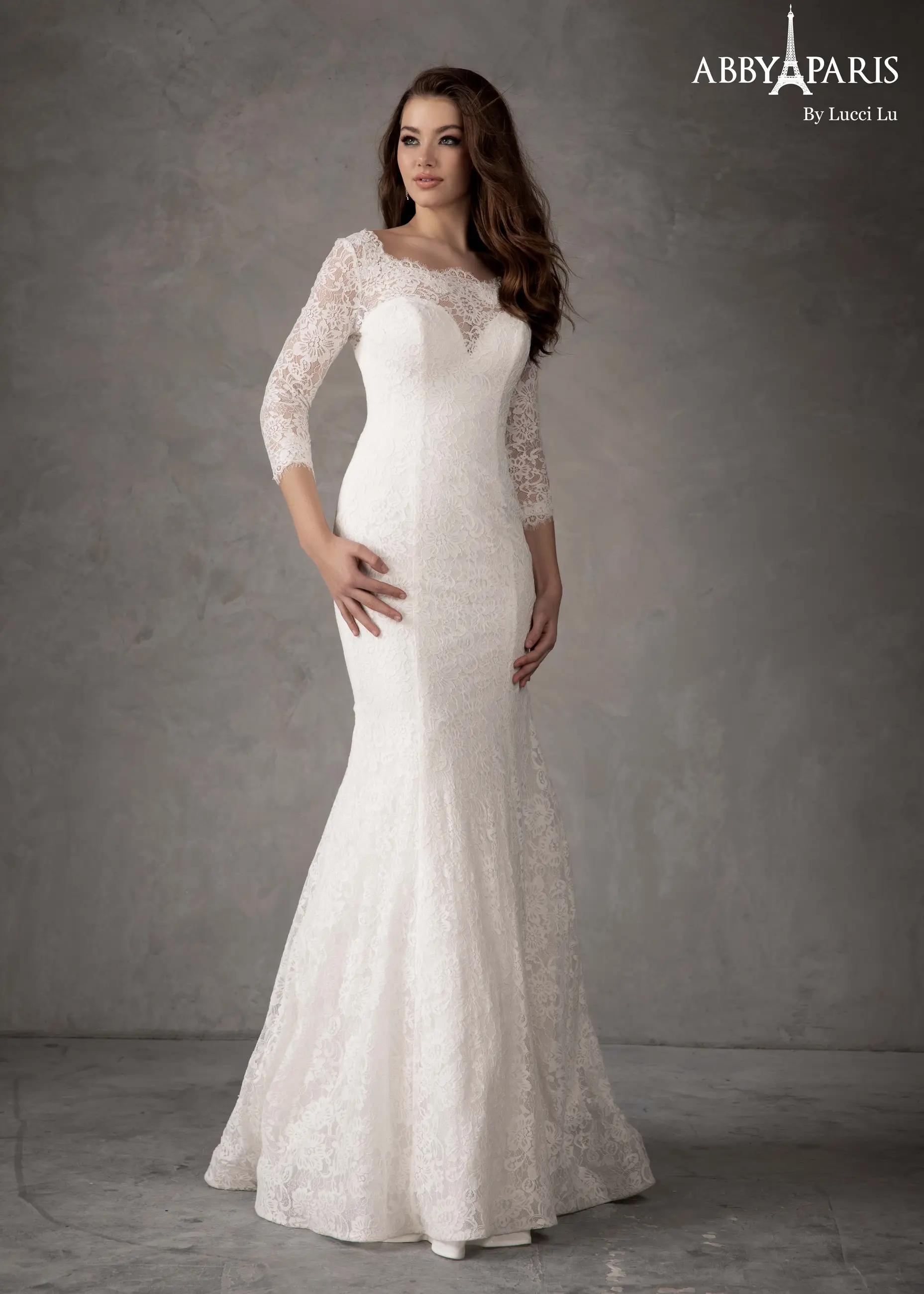 Model wearing a Lucci Lu Abby Paris white bridal dress