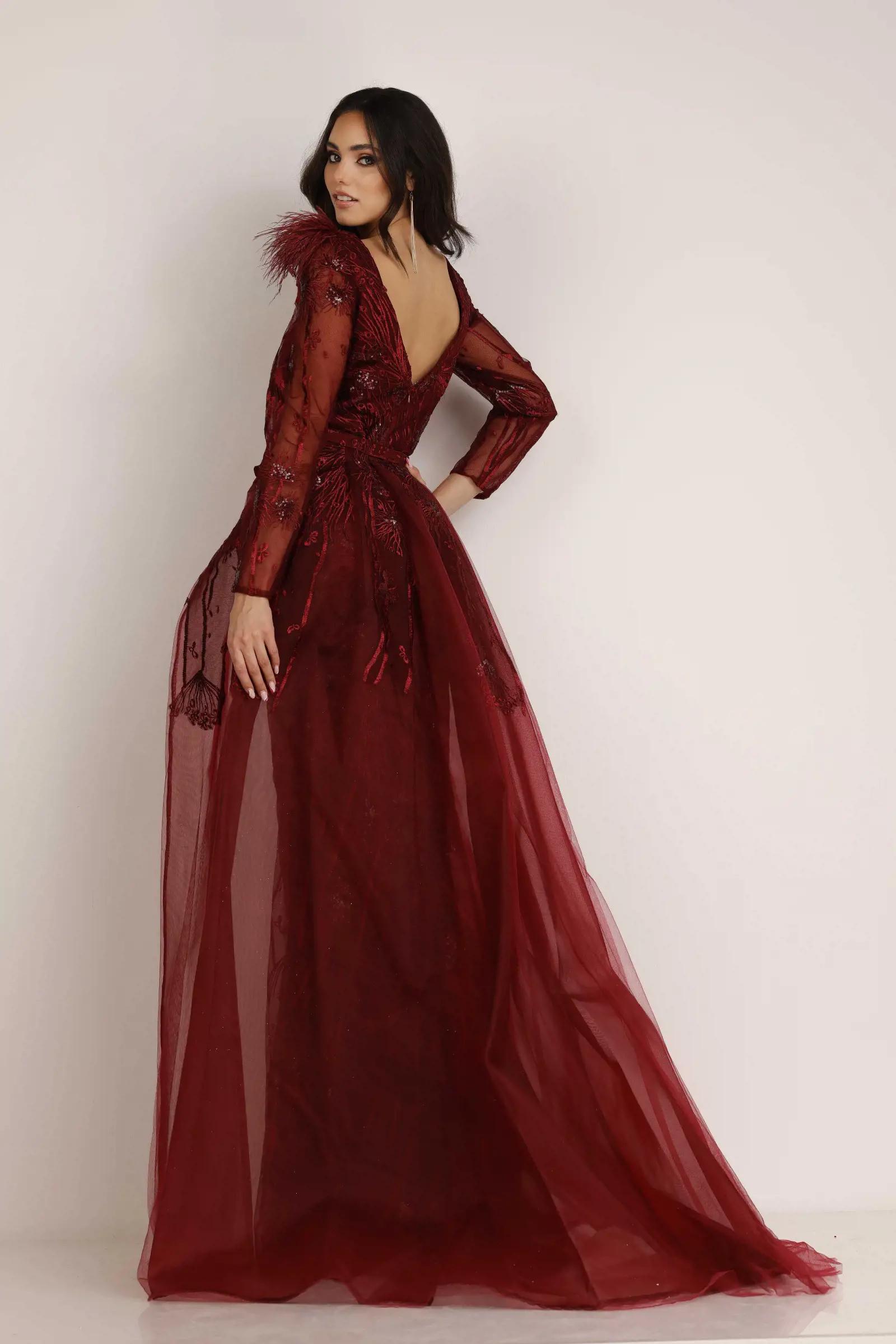 Model wearing a Lucci Lu Fall red gown