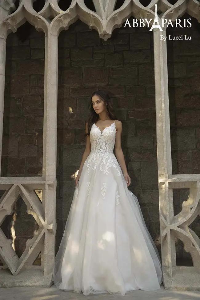 Model wearing a Lucci Lu bridal gown