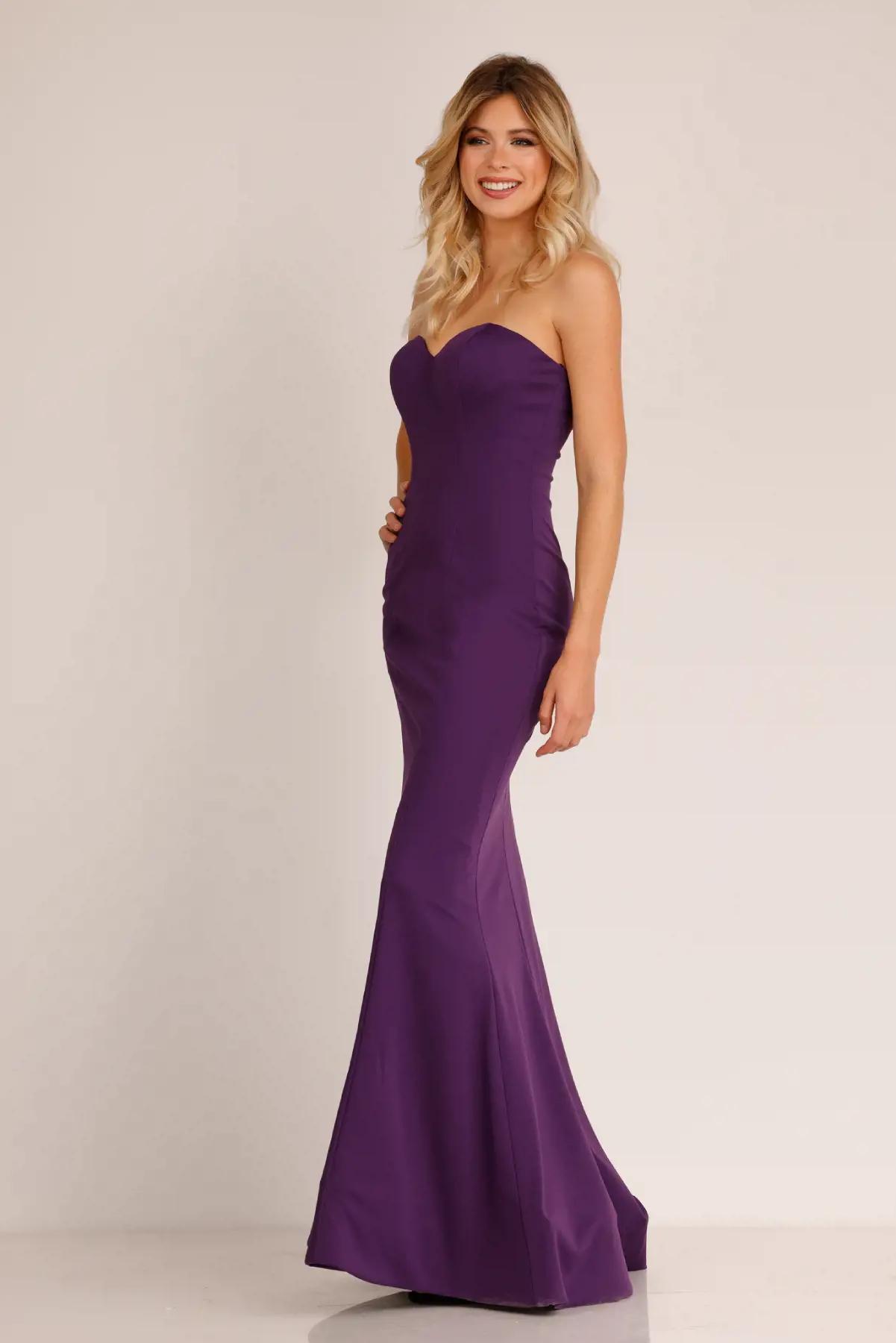Model wearing an Abby Paris FW purple gown